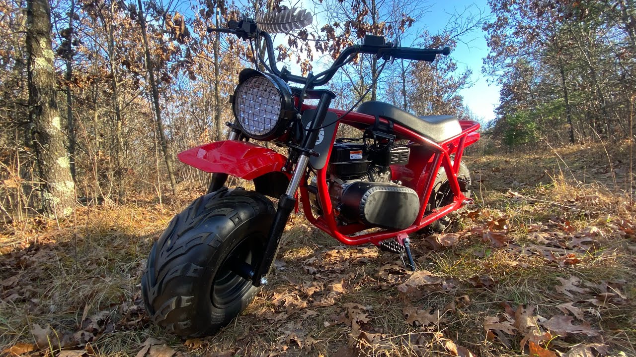 Working on and fixing the mini bike, glad it runs again!