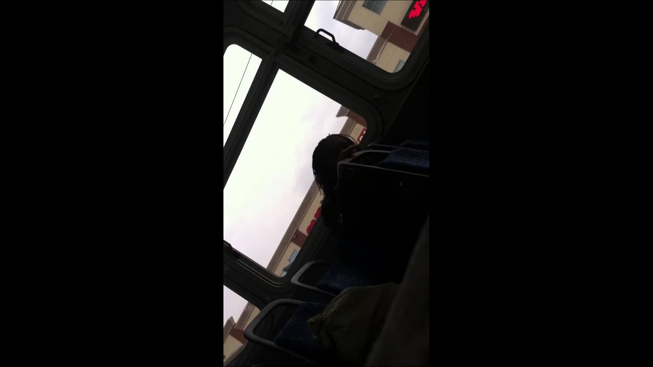 Woman talking to herself on bus home from work