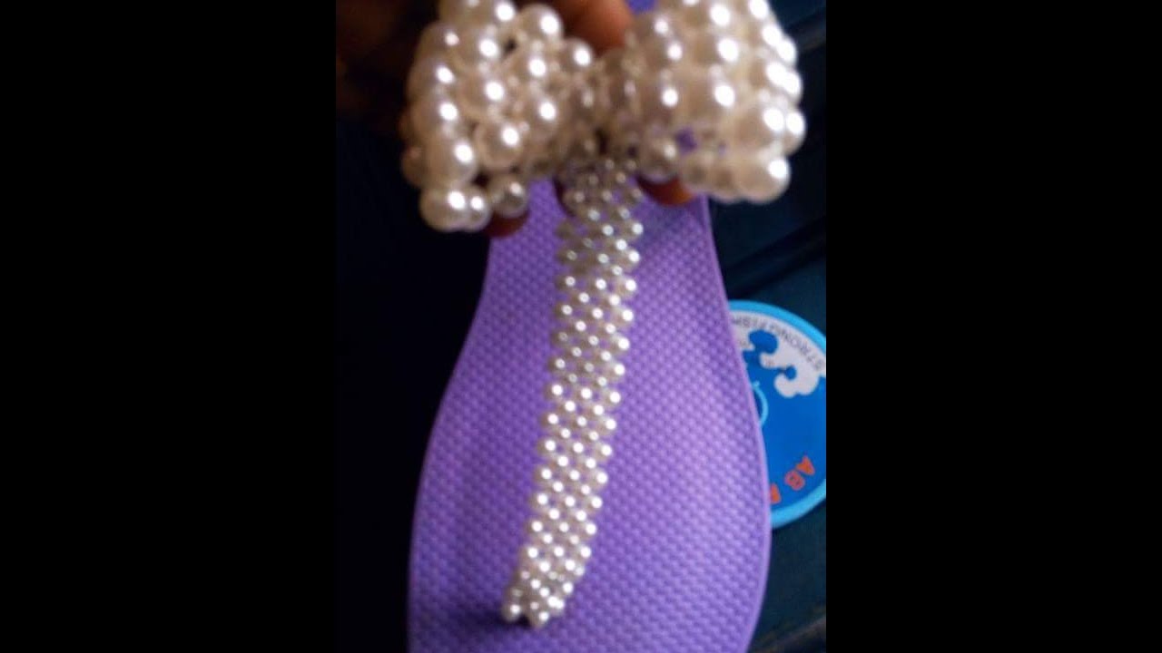the tutorial on how to make this purple and white slippers beads