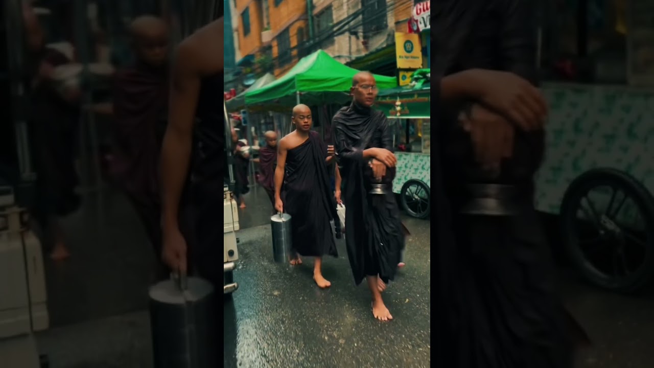 Young monks collecting morning alms in Yangon,  even in the rain. #myanmar #culture