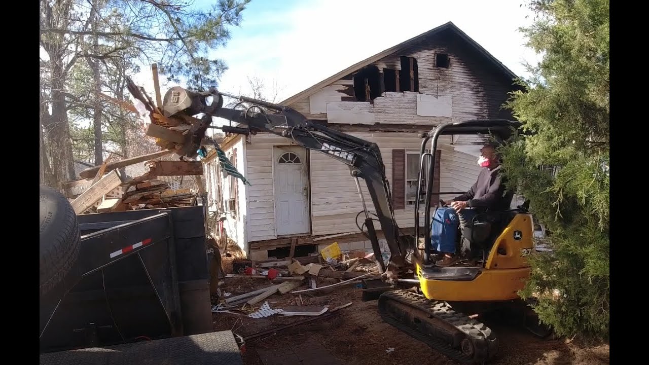 John  Deere Excavator and Ford 6.0 demolishing a Burnt out House