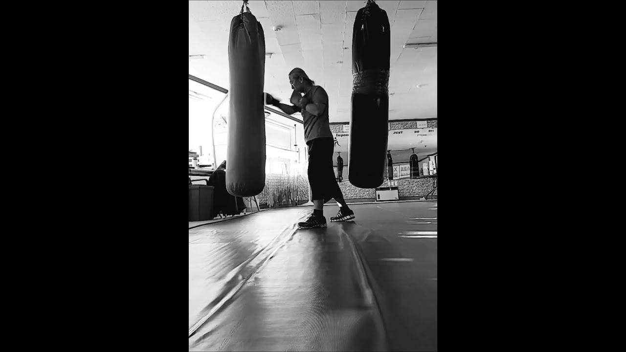 practicing how to hit the sandbag 