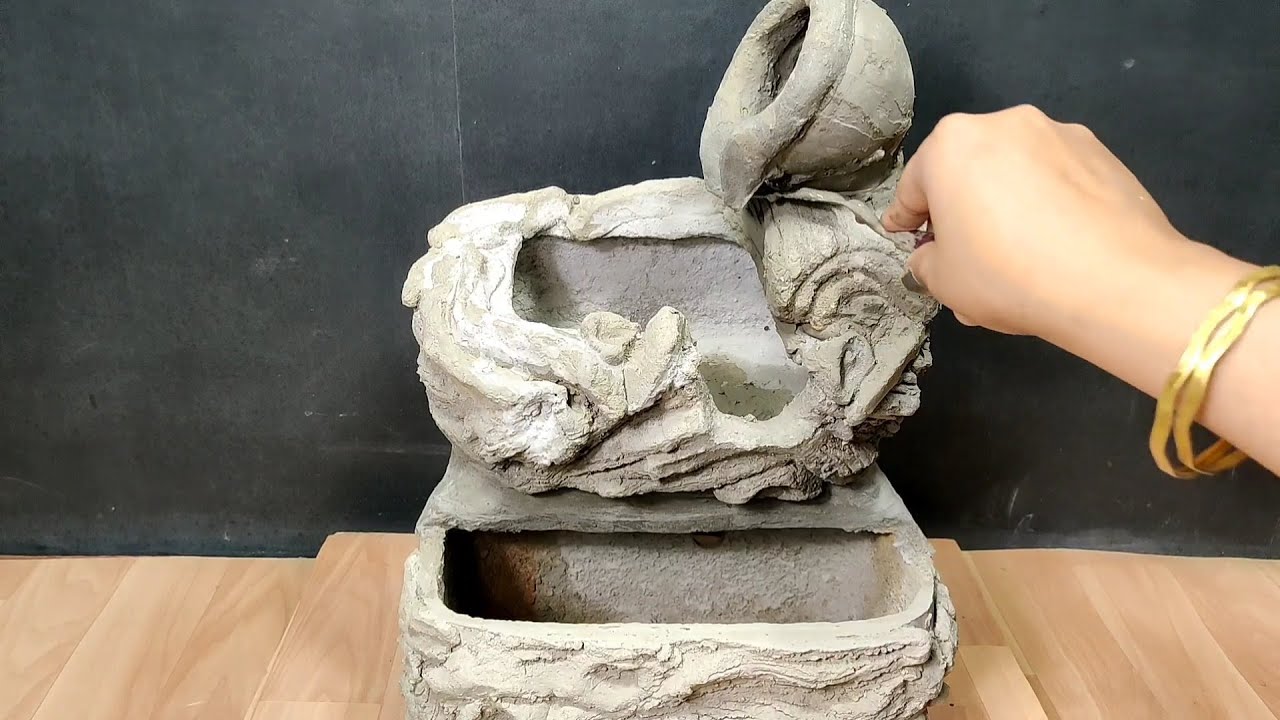 Beautiful handmade waterfall using cement and sand