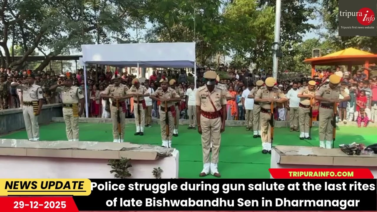 Police struggle during gun salute at the last rites of late Bishwabandhu Sen in Dharmanagar