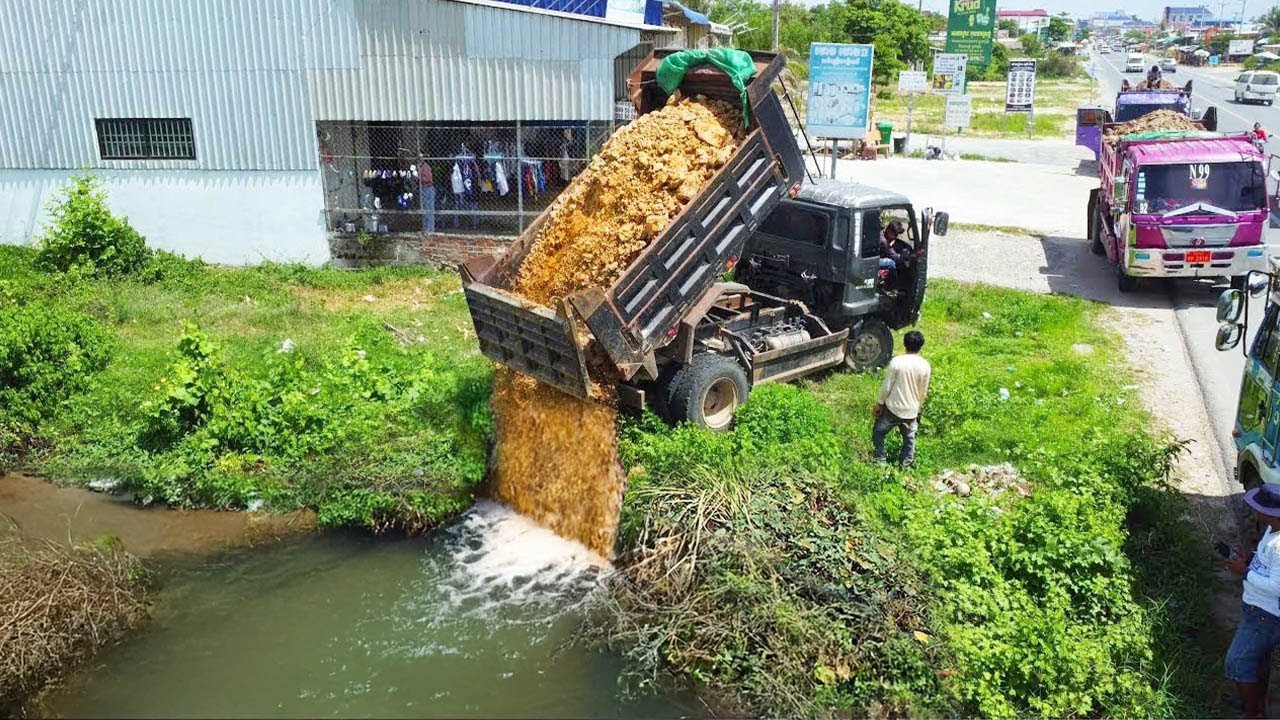 Starting a New Project Filling Flooded Pond!! Mini Bulldozer Pushing Soil into water with 5ton truck
