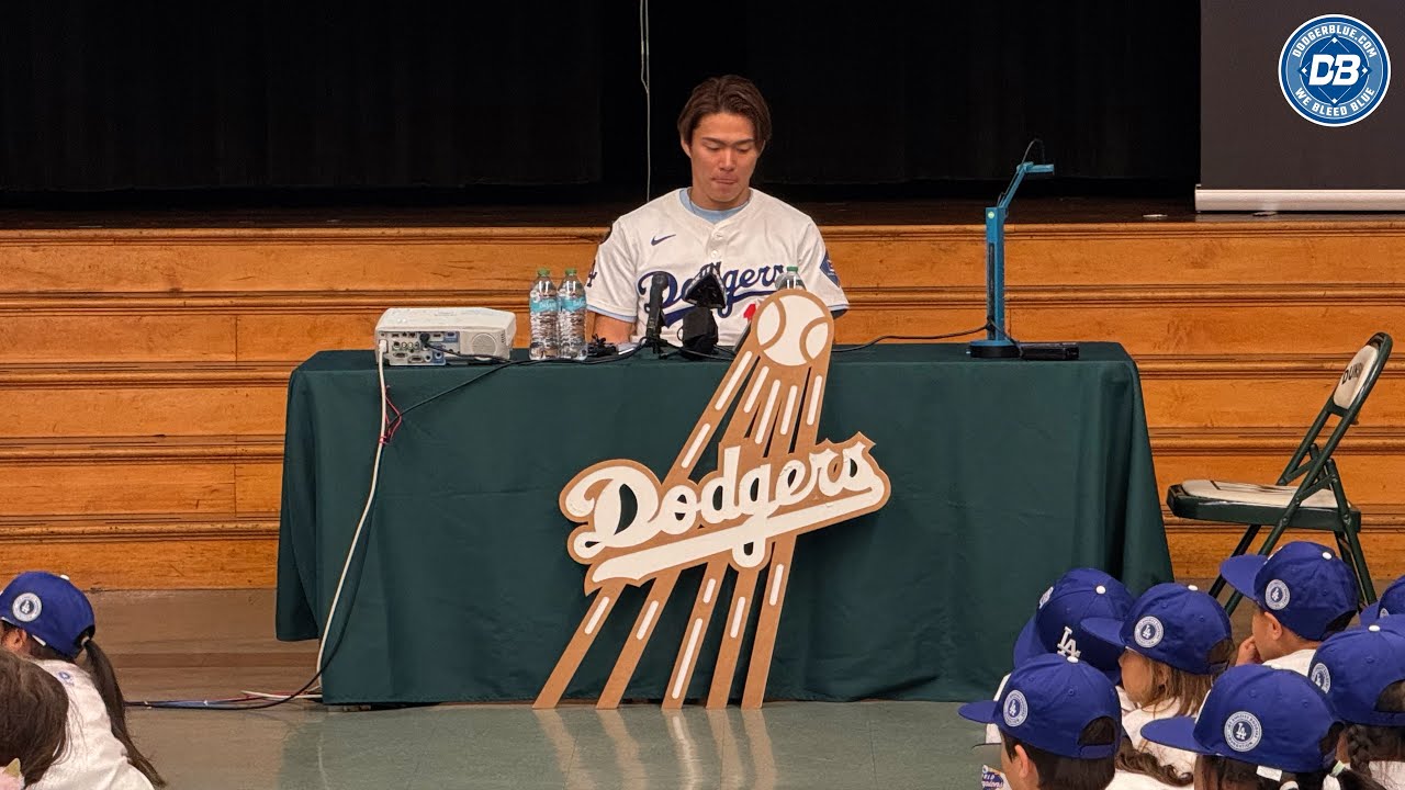 Yoshinobu Yamamoto reads to children at Dunsmore Elementary School as part of LA Dodgers Foundation