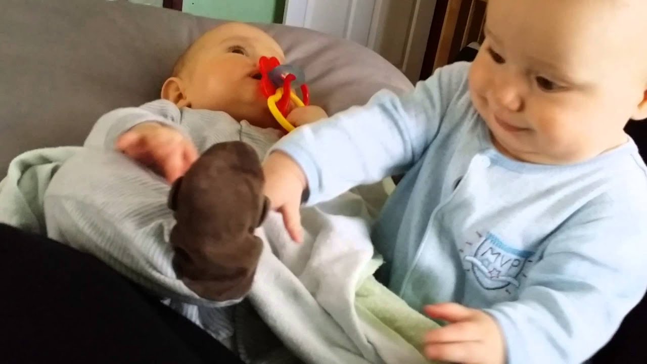 Foot eating, fighting twin babies