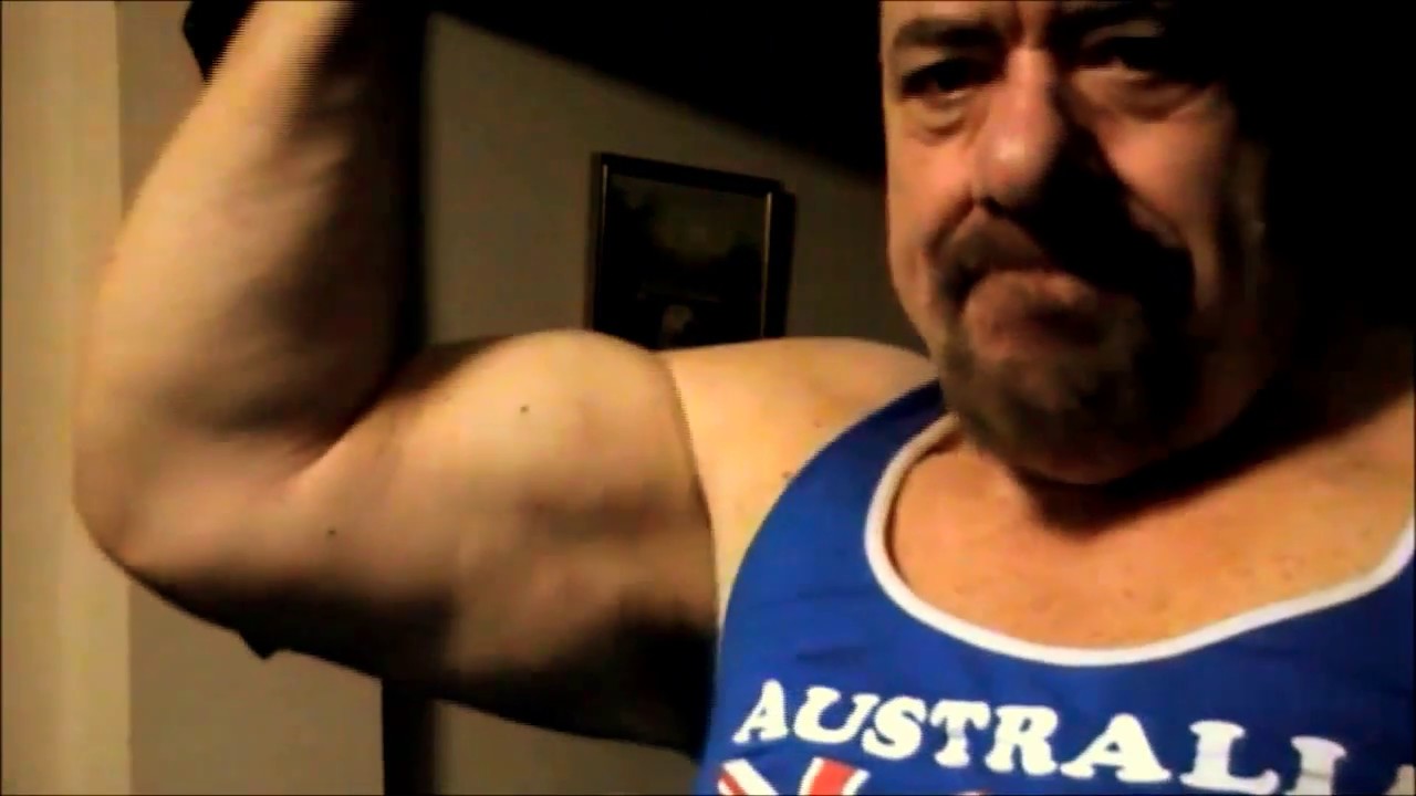 70 YEARS OLD POSING AND FLEXING CHEST AND BICEPS,...