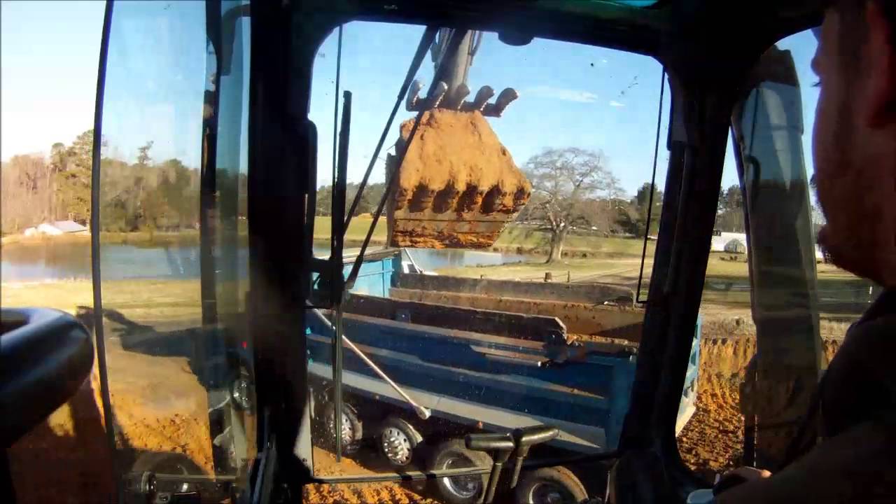 Volvo 210 Excavator Loading Trucks