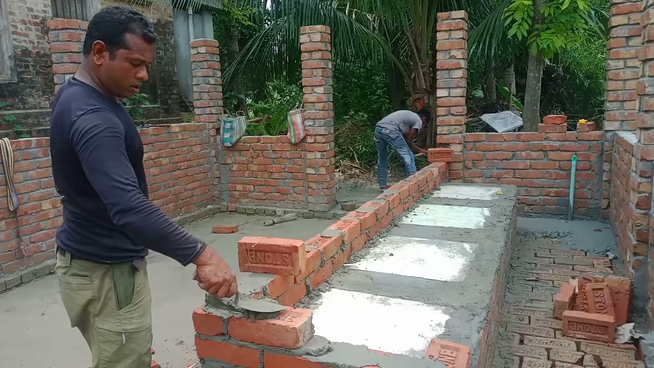 রাখাল এগ্রোর গরুর খাবারের পাএের নিচে টাইলস দিচ্ছে