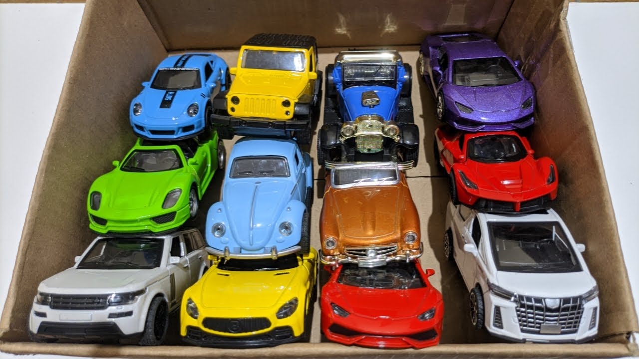 モデルカーが詰まったボックス - マツダ Mx5、ケーニゲスグ ジェスコ、ランボルギーニ Scv12、バイド ヤン ワン U8、トヨタ車