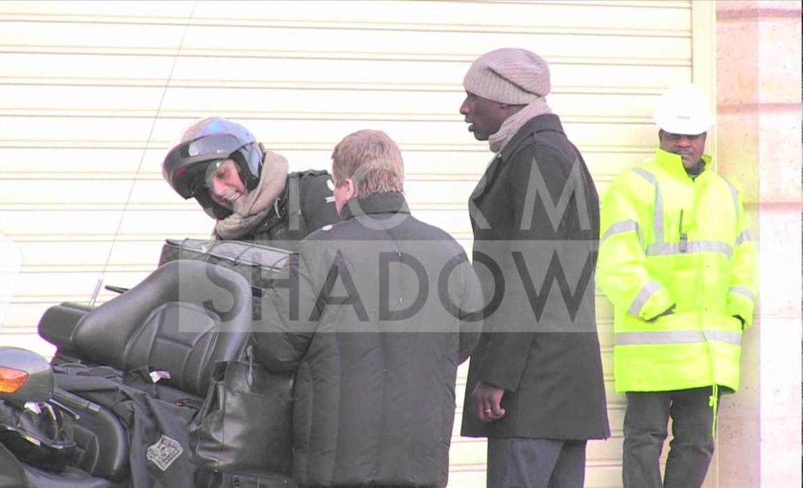 Intouchable star Omar Sy having a cigarette outside hotel in Paris