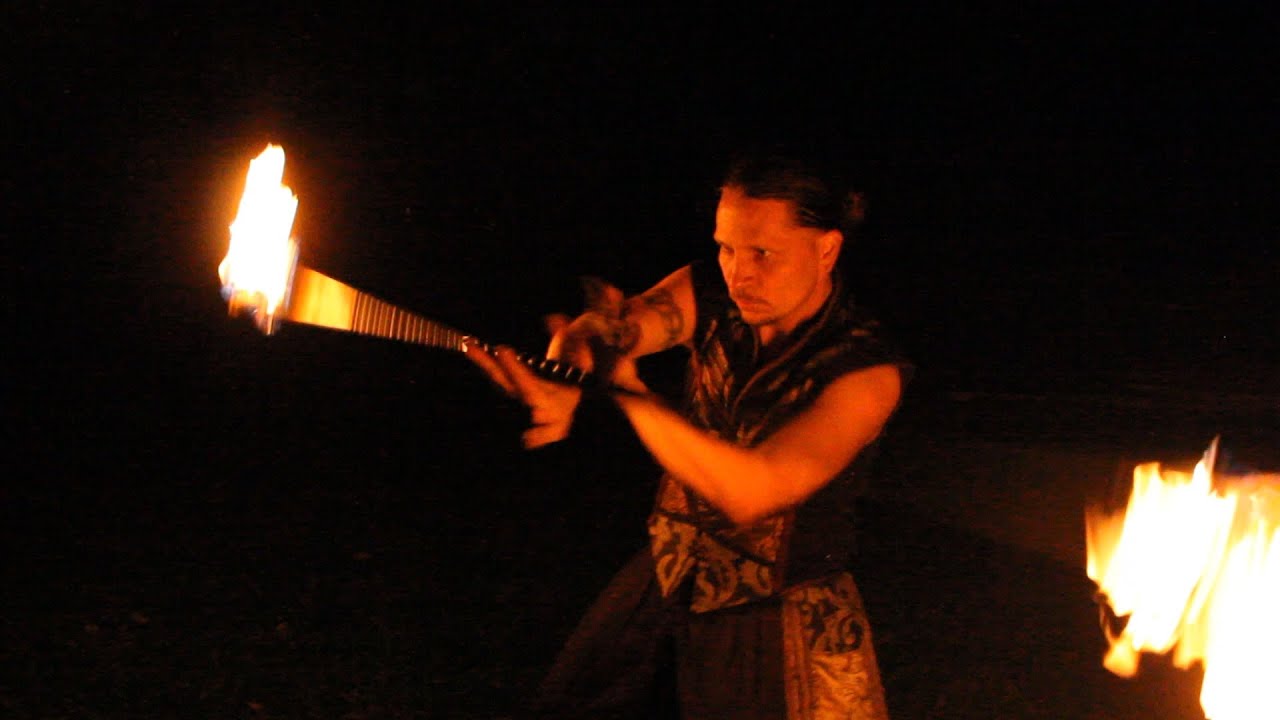 Cyricx spins Fire Contact Staff