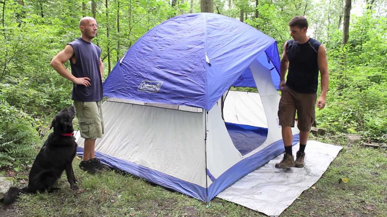 Taking down a tent and fitting it back in the bag