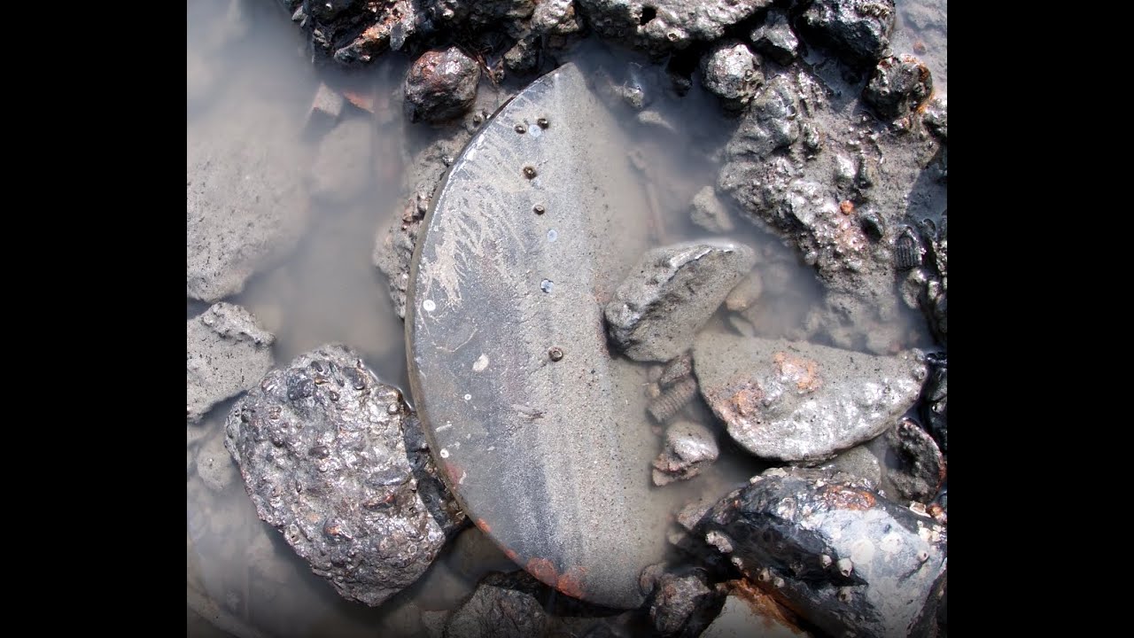 Mudlarking, finding the glass of a porthole