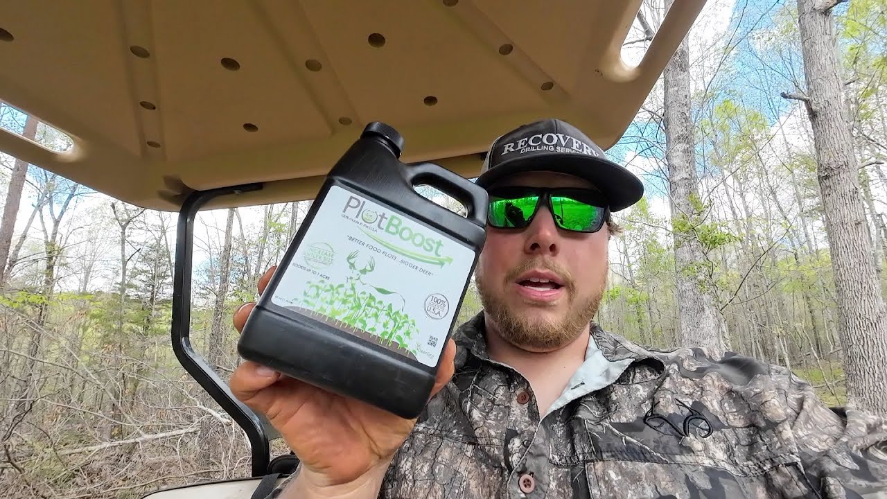 Spraying Deer Gro Plot Boost on Clover Plots
