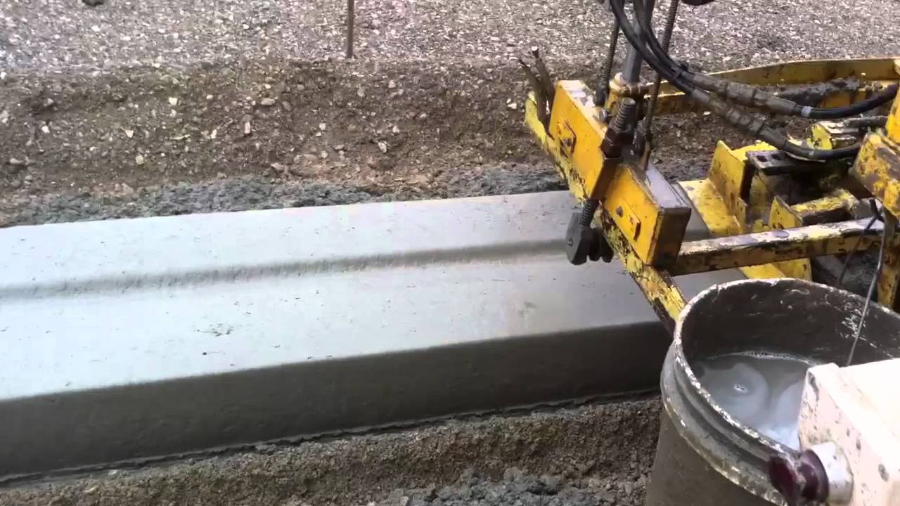 Gomaco Commander III with a driveway cutout and finishing