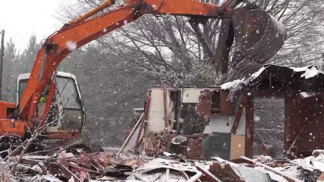 House Demolition And Debris Removal During Snowstorm (HD)