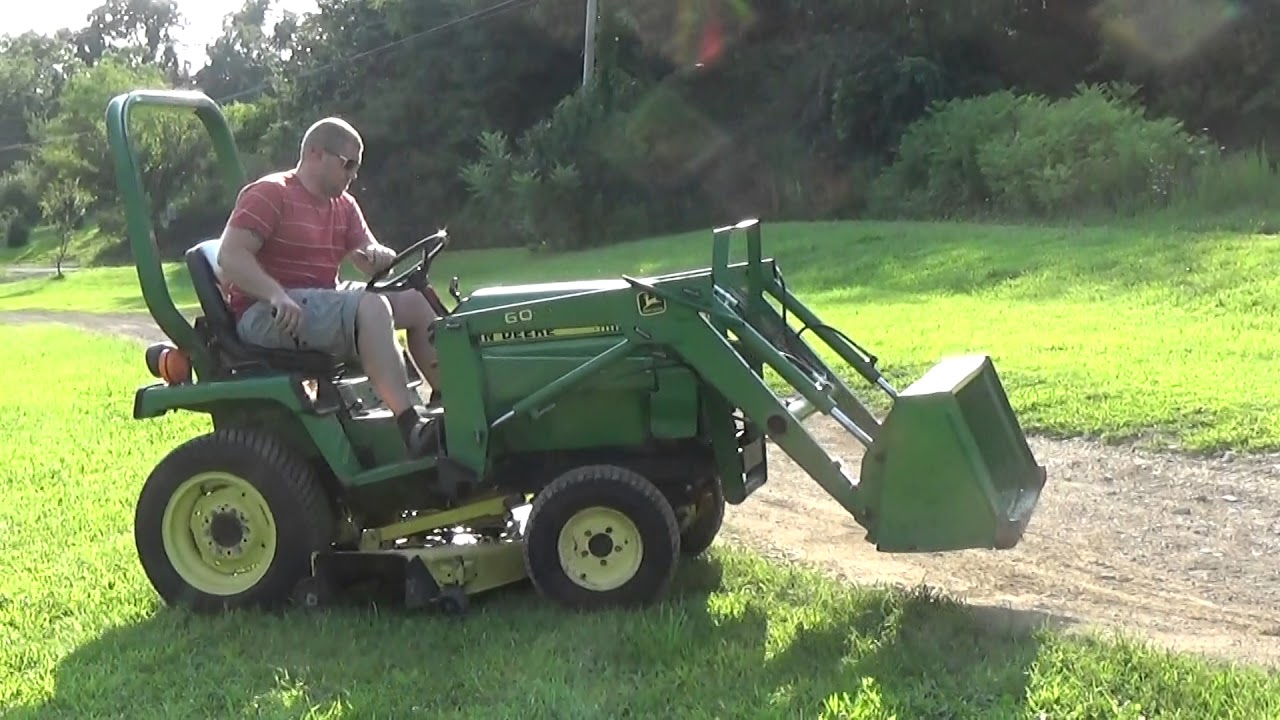 JOHN DEERE 655 4x4 TRACTOR WITH LOADER , BELLY MOWER, AND MANUALS
