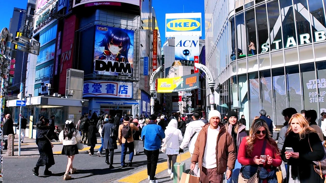 Walking tour in Shibuya city on a sunny day. Tokyo, Japan. 