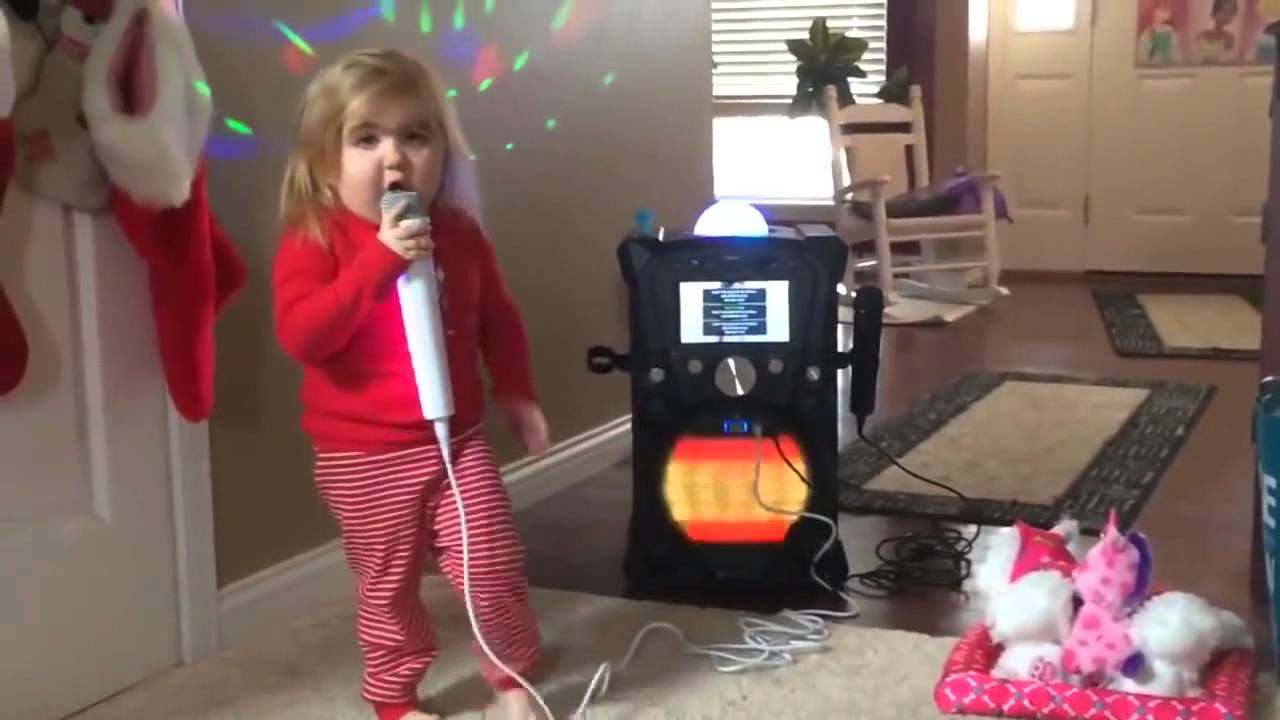Funny cute girl singing What Makes You Beautiful - One Direction