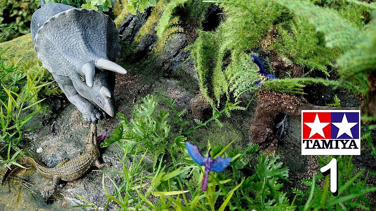 Triceratops Crocodile an Archeopteryx in a Mesozoic diorama.