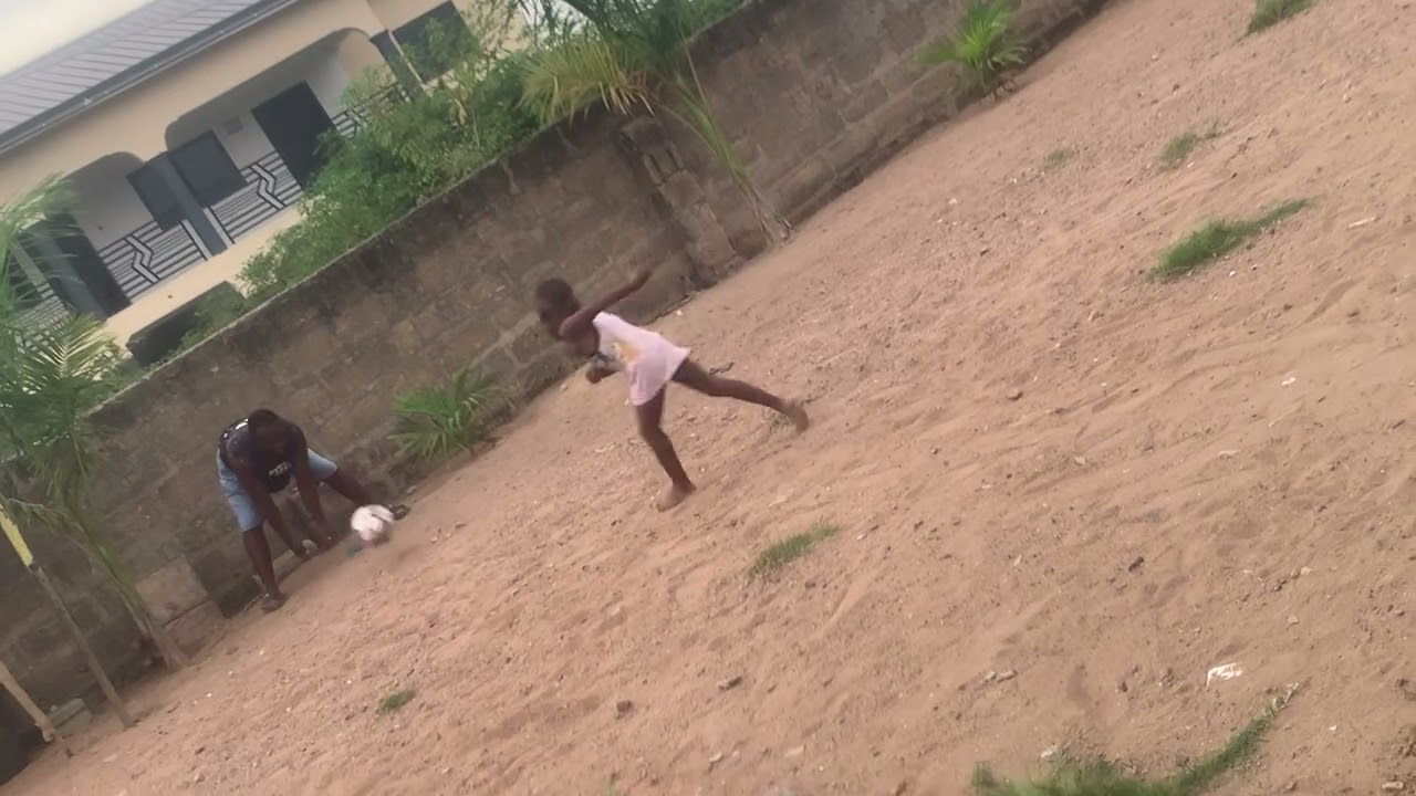 My boy is practicing how to kick a penalty 