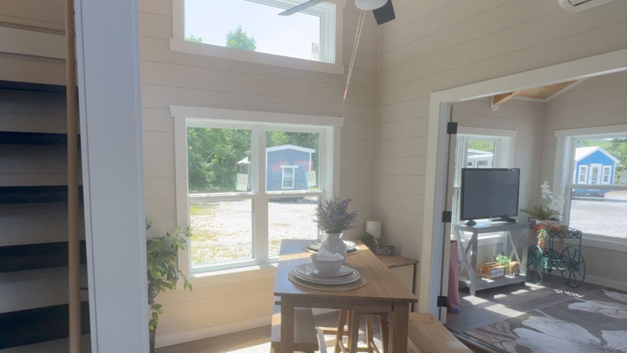 THIS Tiny House has it ALL!!! SUNROOM, LOFT, WALK-IN CLOSET, BONUS ROOM and Extra BATH in this Home!