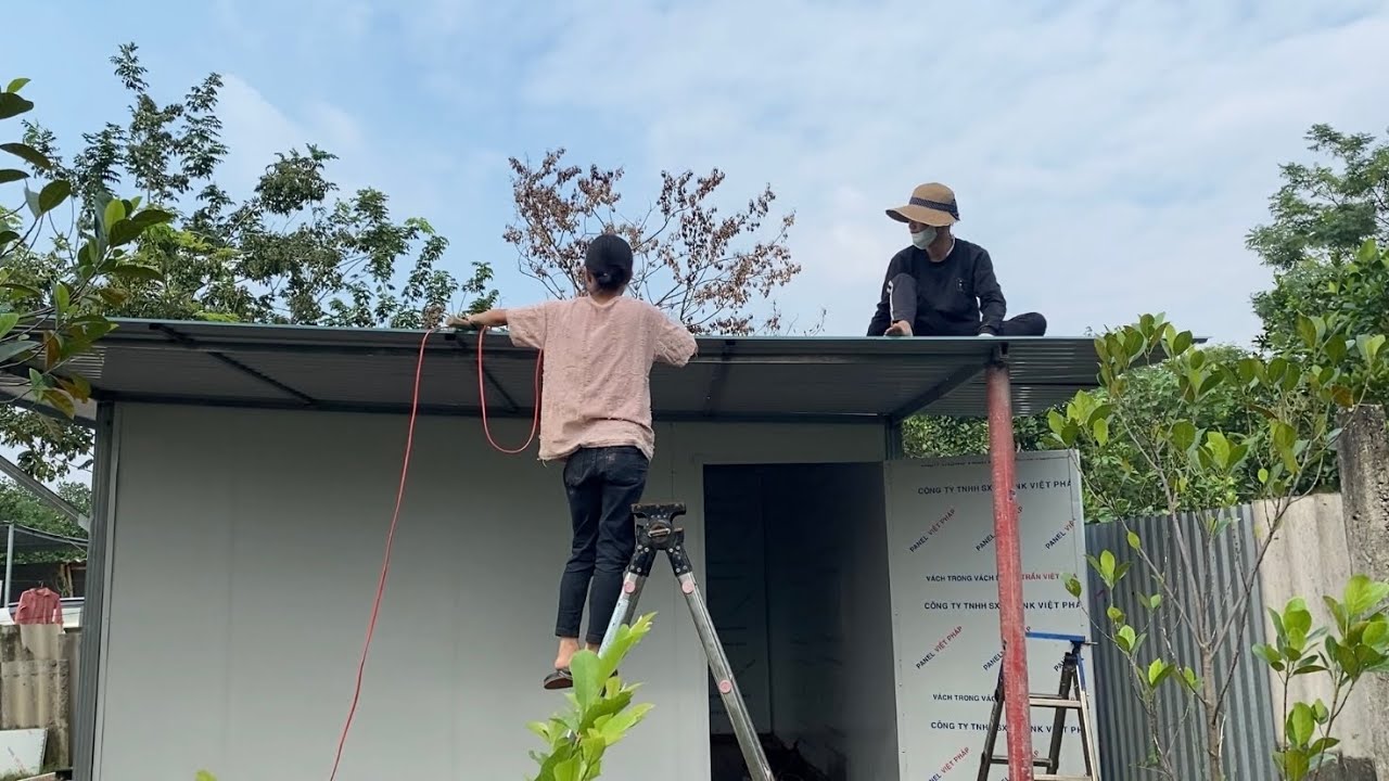 The couple is building their home, making the gate, and setting up the bathroom ready for a new life
