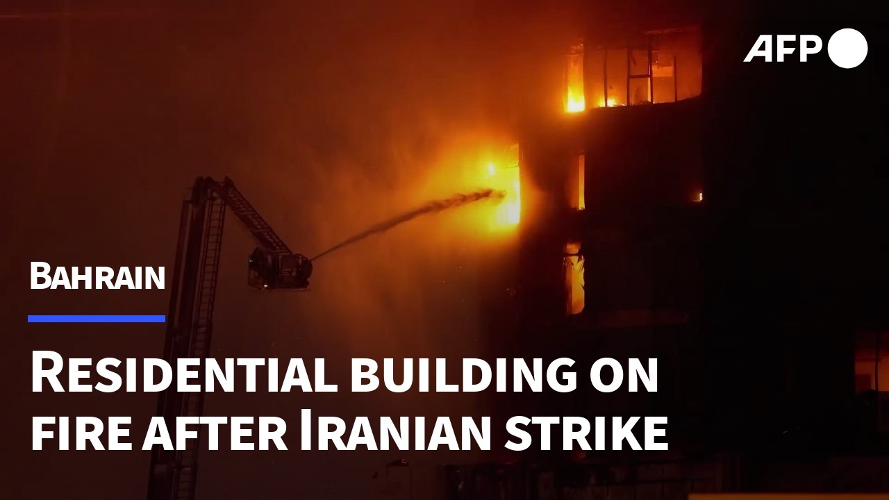 Residential building in Bahrain on fire after Iranian drone attack | AFP