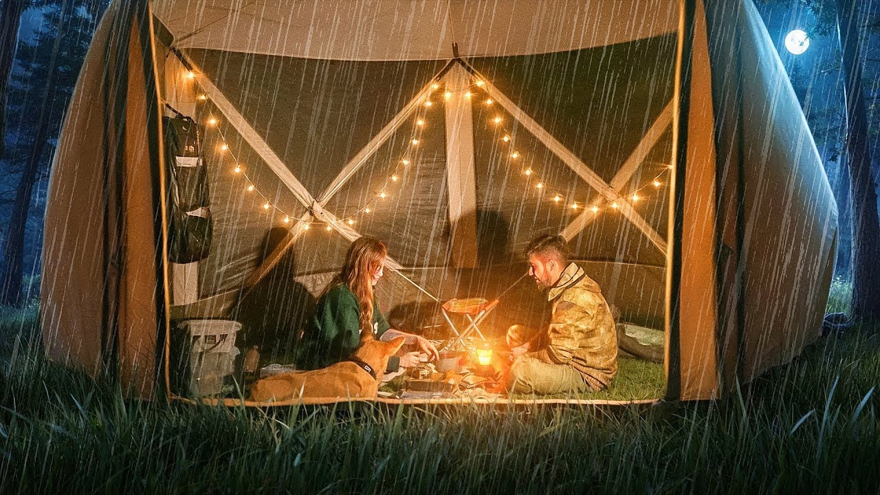 A cozy refuge: riding out the storm in a tent with my love & three dogs.