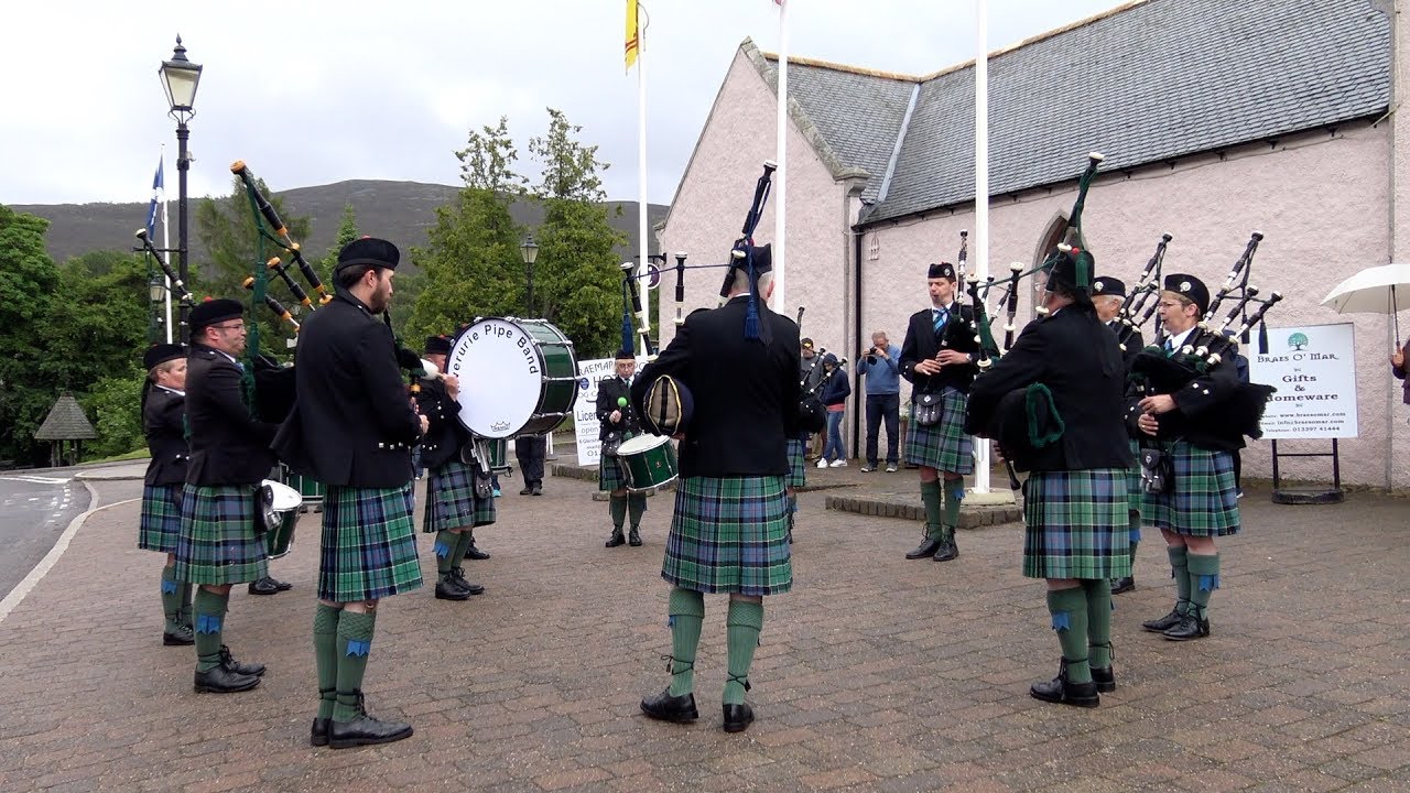 Inverurie Pipe Band playing by Braemar Mews in the highlands, Deeside, Scotland July 2017