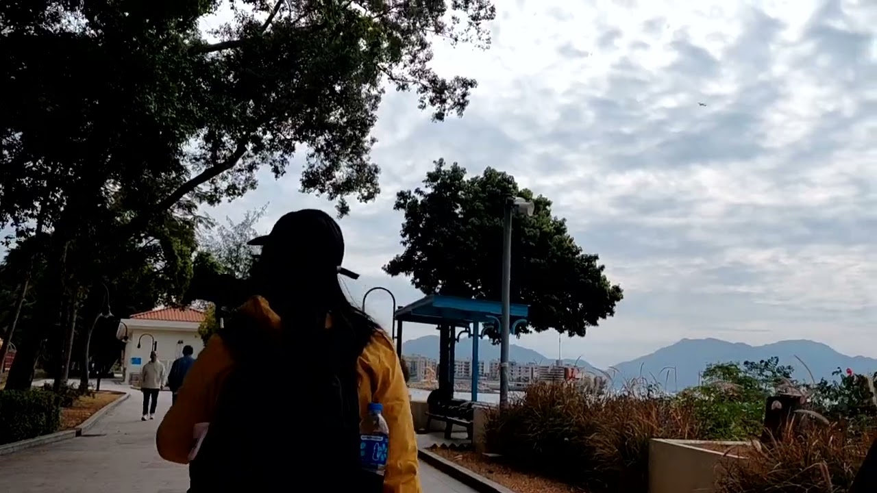 Walking along  with friends at tsuen mun coastal gold 