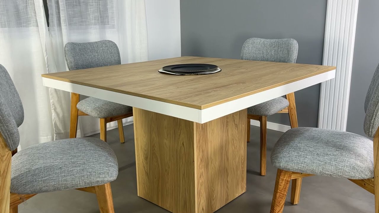 Hermosa y moderna mesa de comedor cuadrada con base en el centro