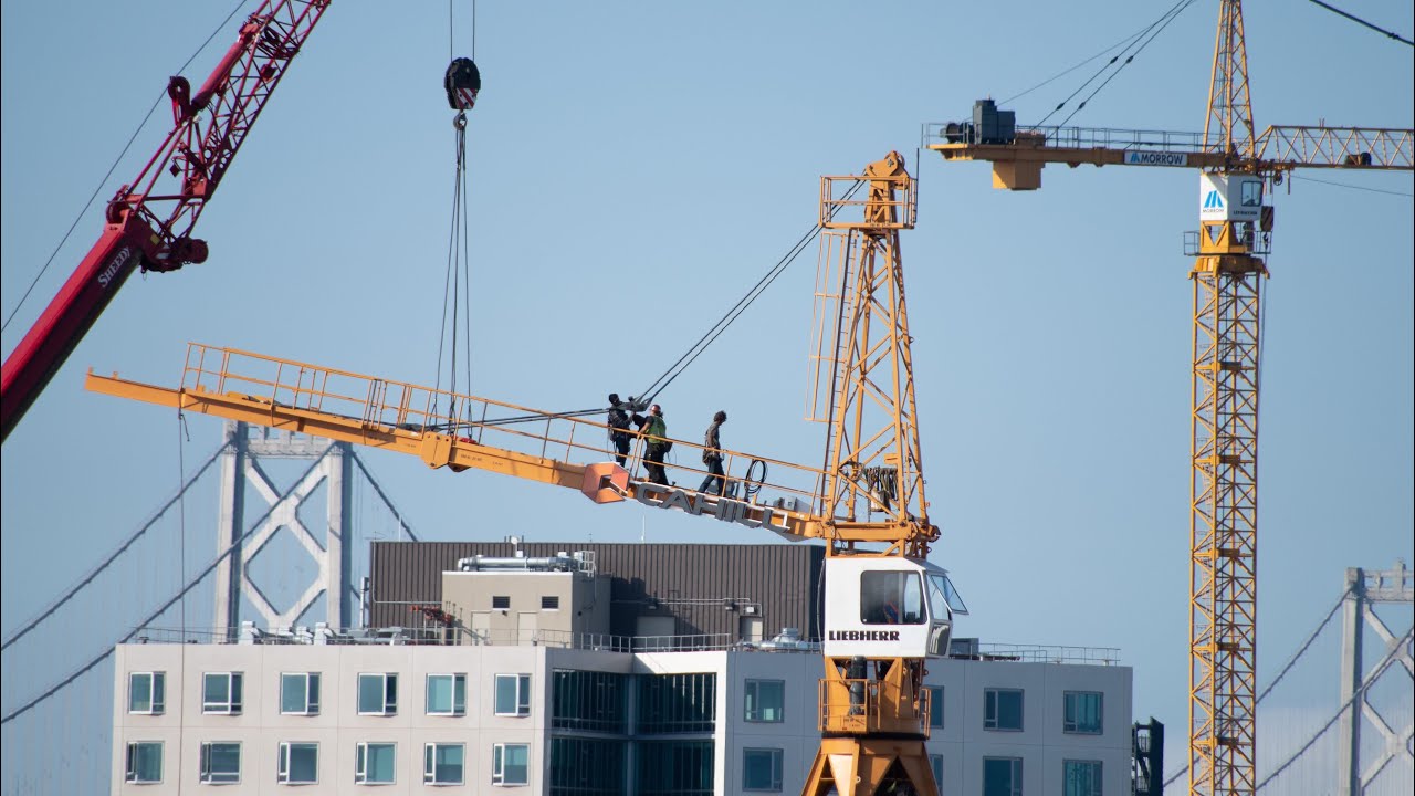 Ironworkers taking down a tower crane Oakland California