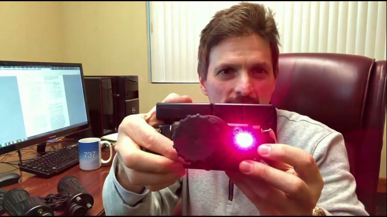 David Mason shows his night vision light to sound invention