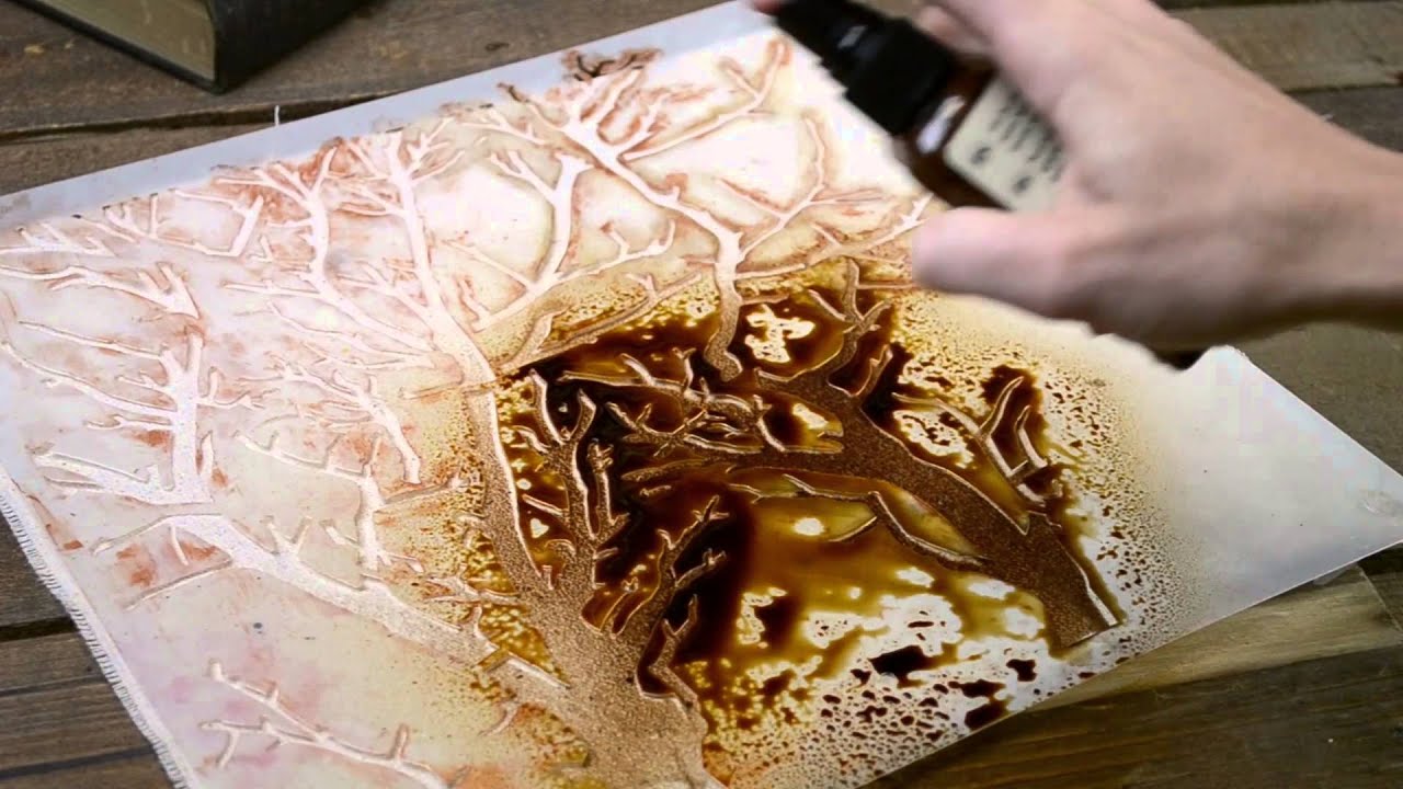 Spraying a Canvas Pillow with Tattered Angels Paint