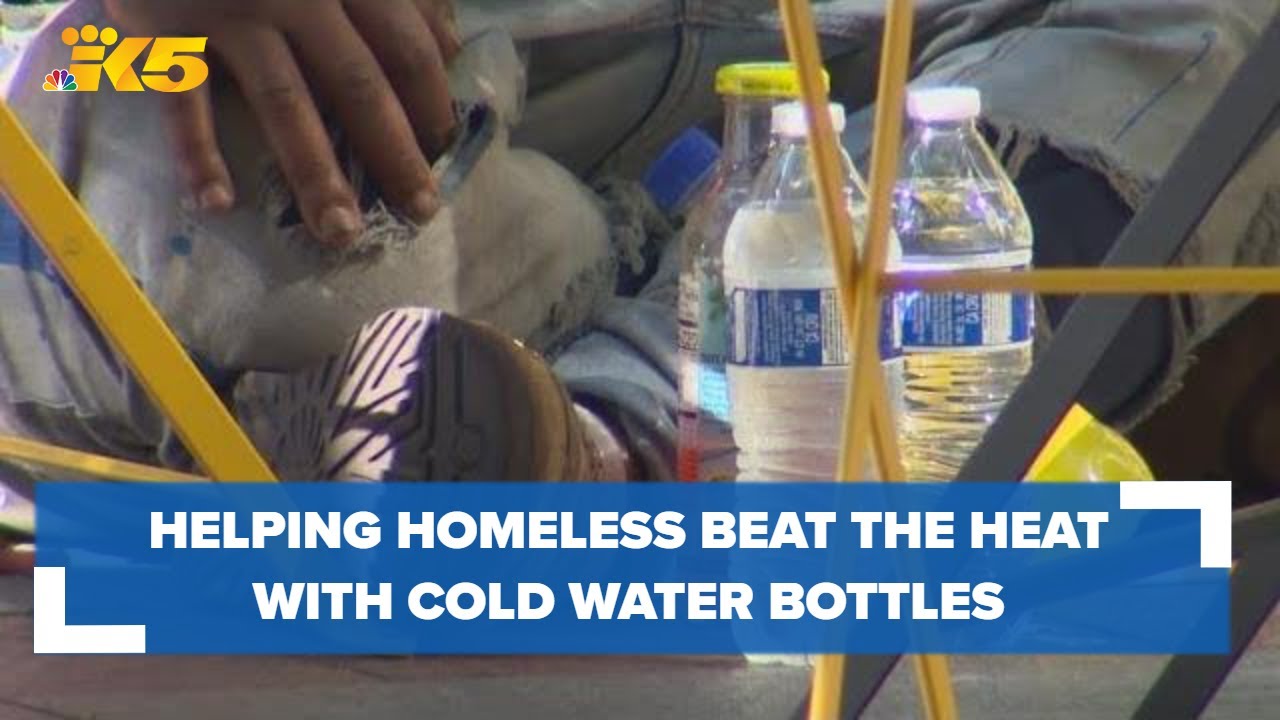 Helping homeless beat the heat by getting cold water bottles straight into their hands