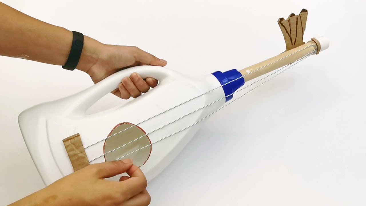 como hacer una guitarra con material reciclable para niños
