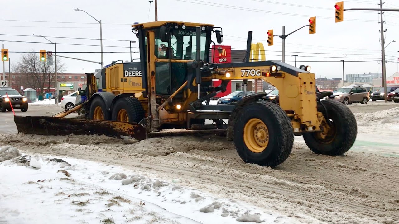 Snow Removal Grader Plowing Snow