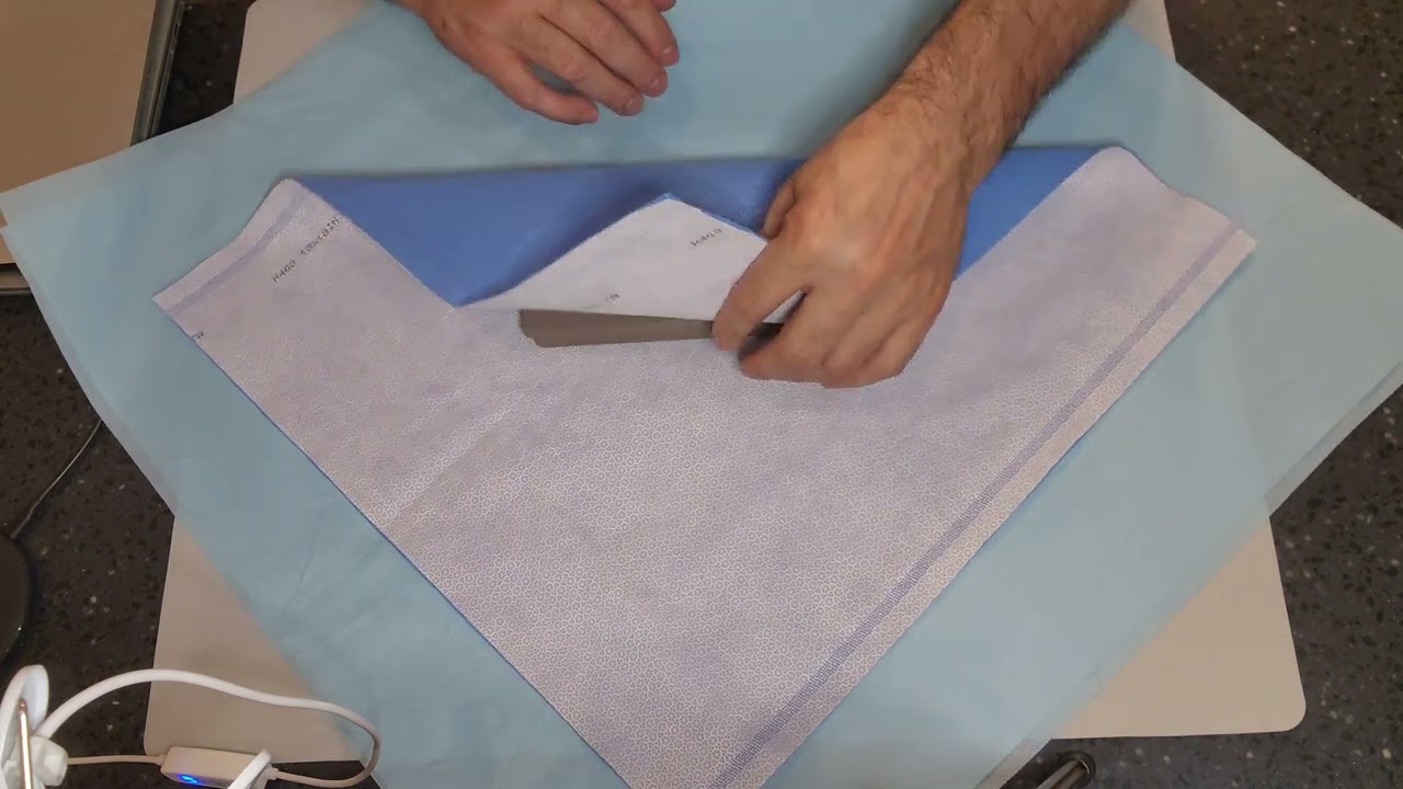 Demonstrating Sequential and Simultaneous wrap technique utilizing the envelope fold.