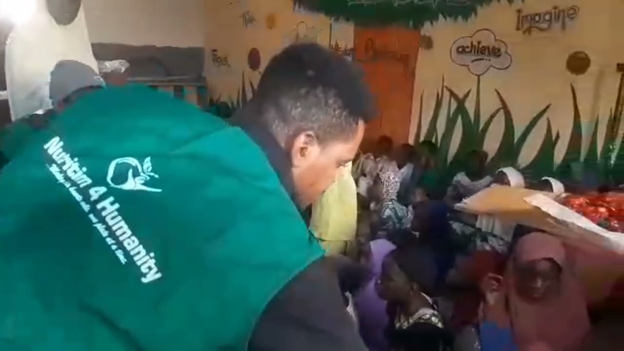 Feeding orphans at Al Ihsan orphanage,  Kaduna.