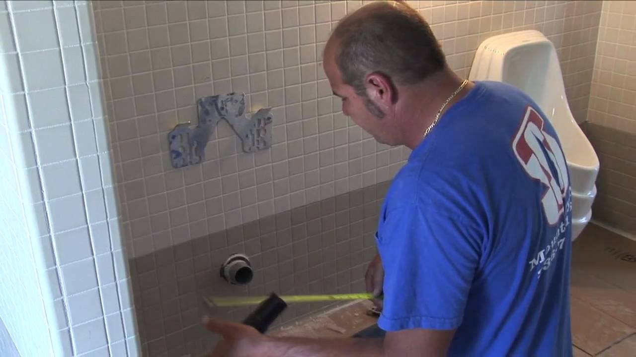 How to install a waterless urinal in a commercial restroom