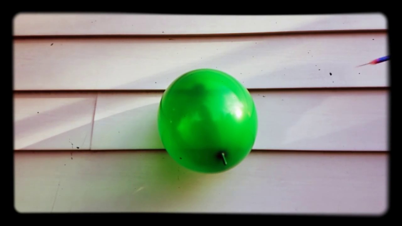 Green Baloon Shot by Nerf Bullet in Slow Motion