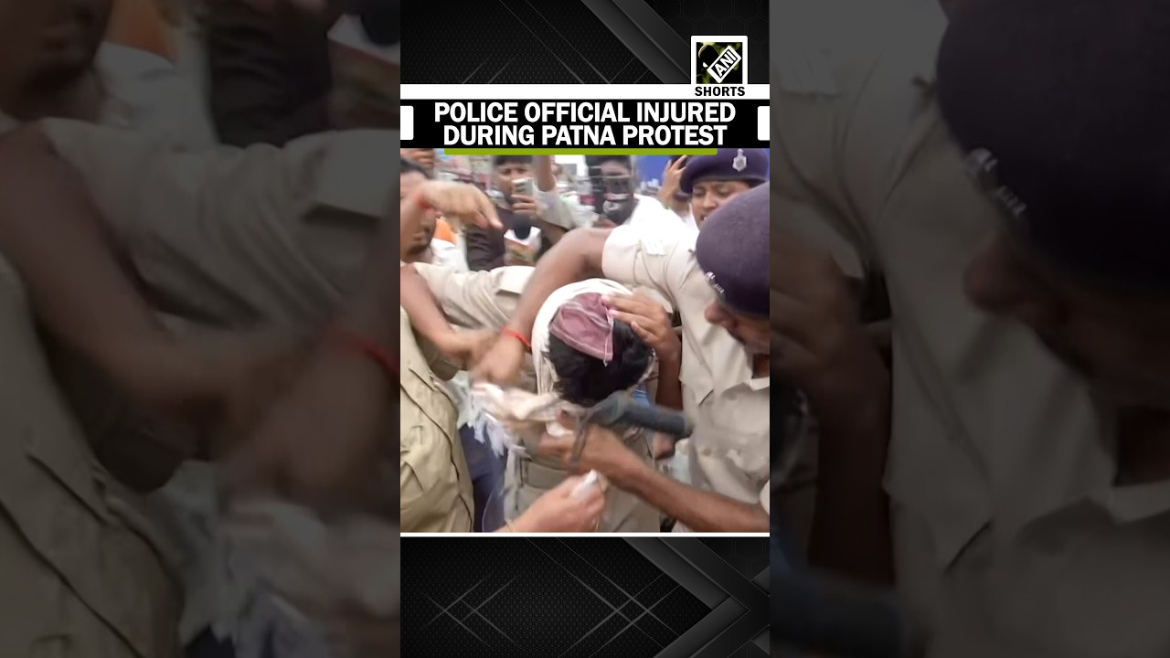 Police personnel suffer injury amid a tense confrontation during a recruitment protest in Patna
