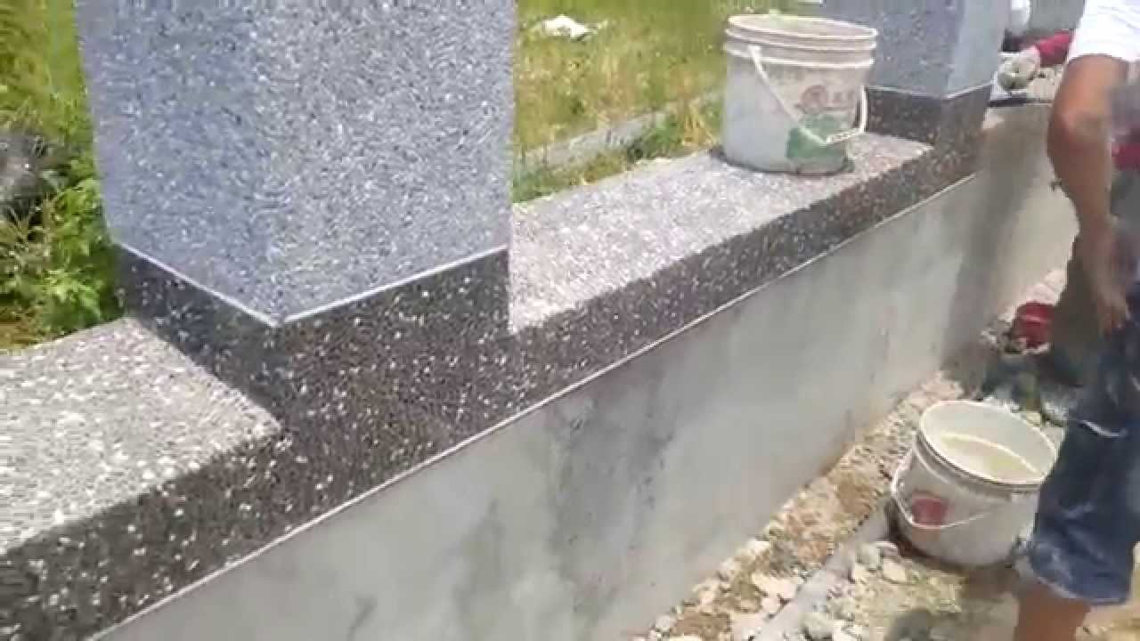 Cement rendering with small stones on brick walls