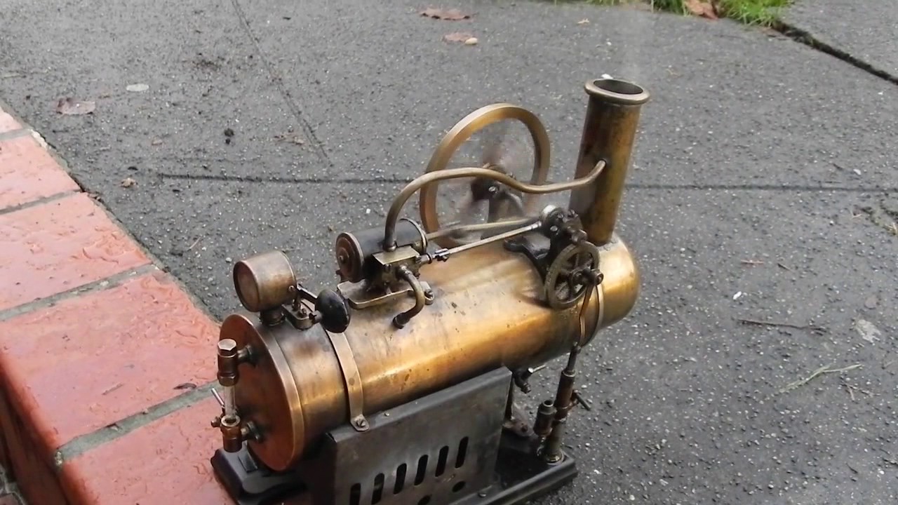 Very early J Falk Overtype stationary steam engine steaming along.