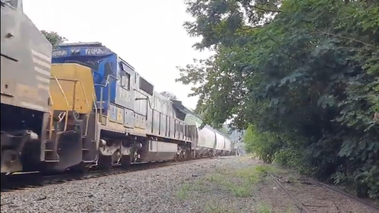ns 16r with ns 8011 leading and a former csx standard cab dash-840c trailling numbered 7622.