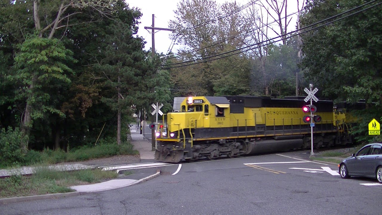 NYS&W SU-99 crawls through old gate-less crossing