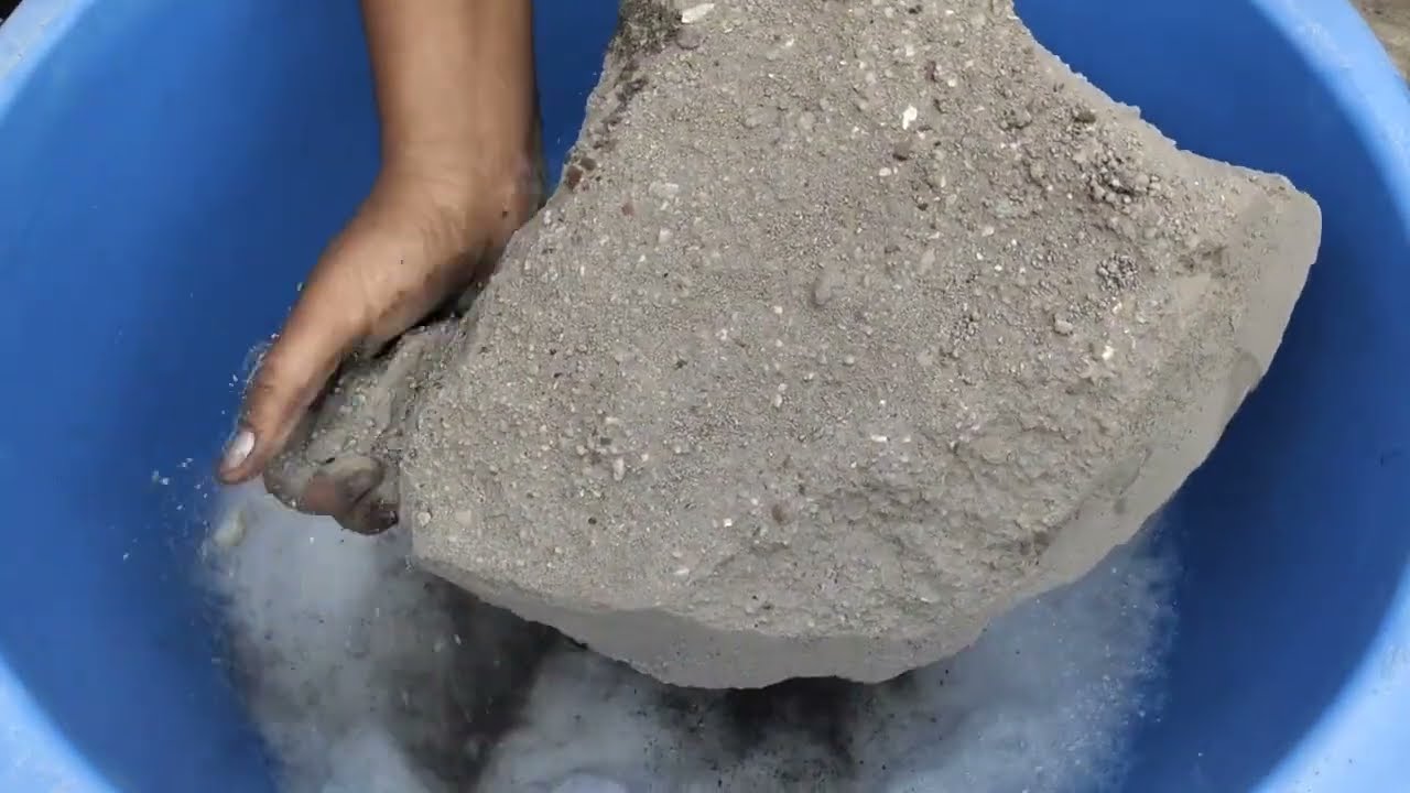 Gritty sand cement crumbling in fommy water 💦💦